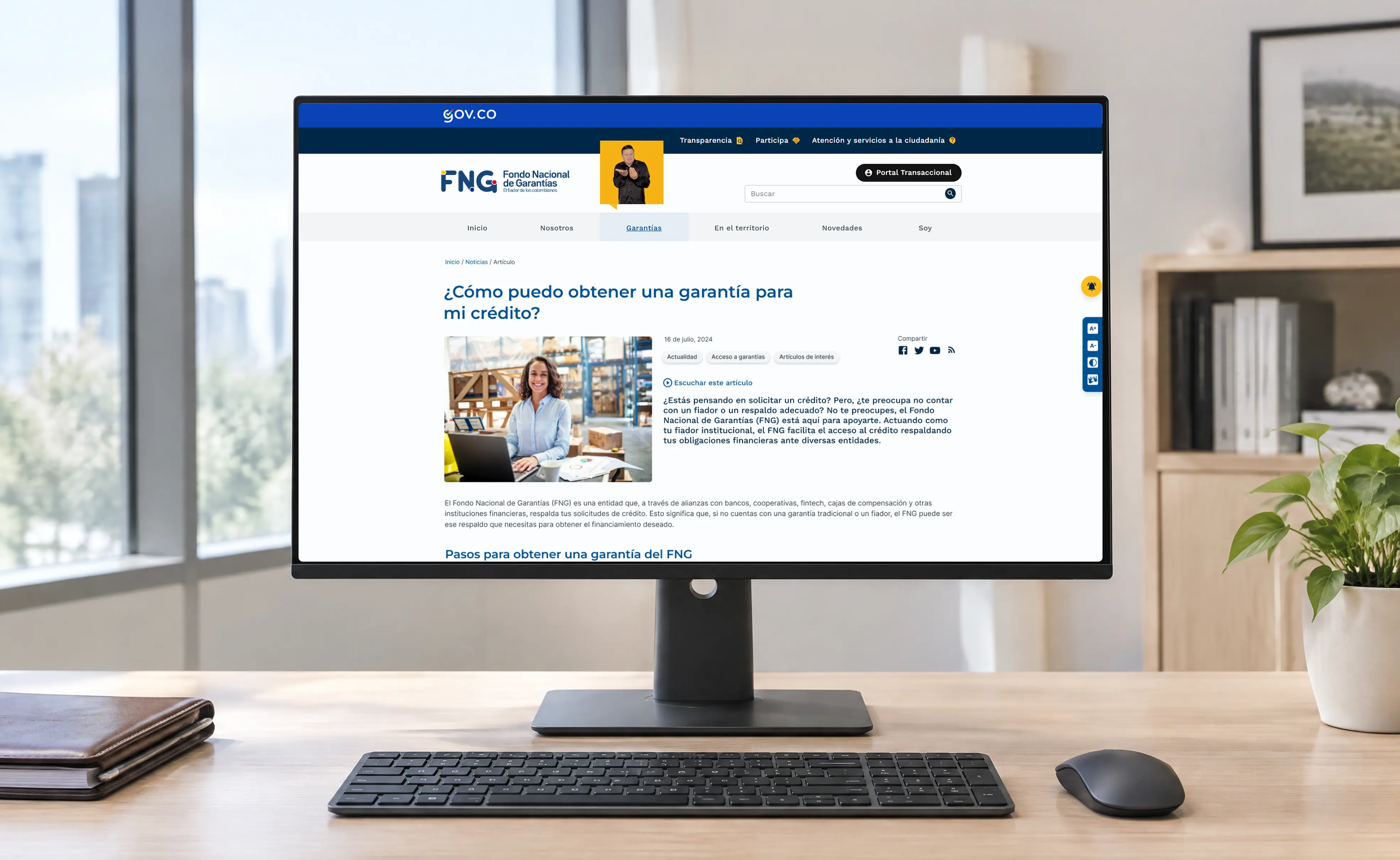 FNG website shown on a monitor on a desk, in front of a window.