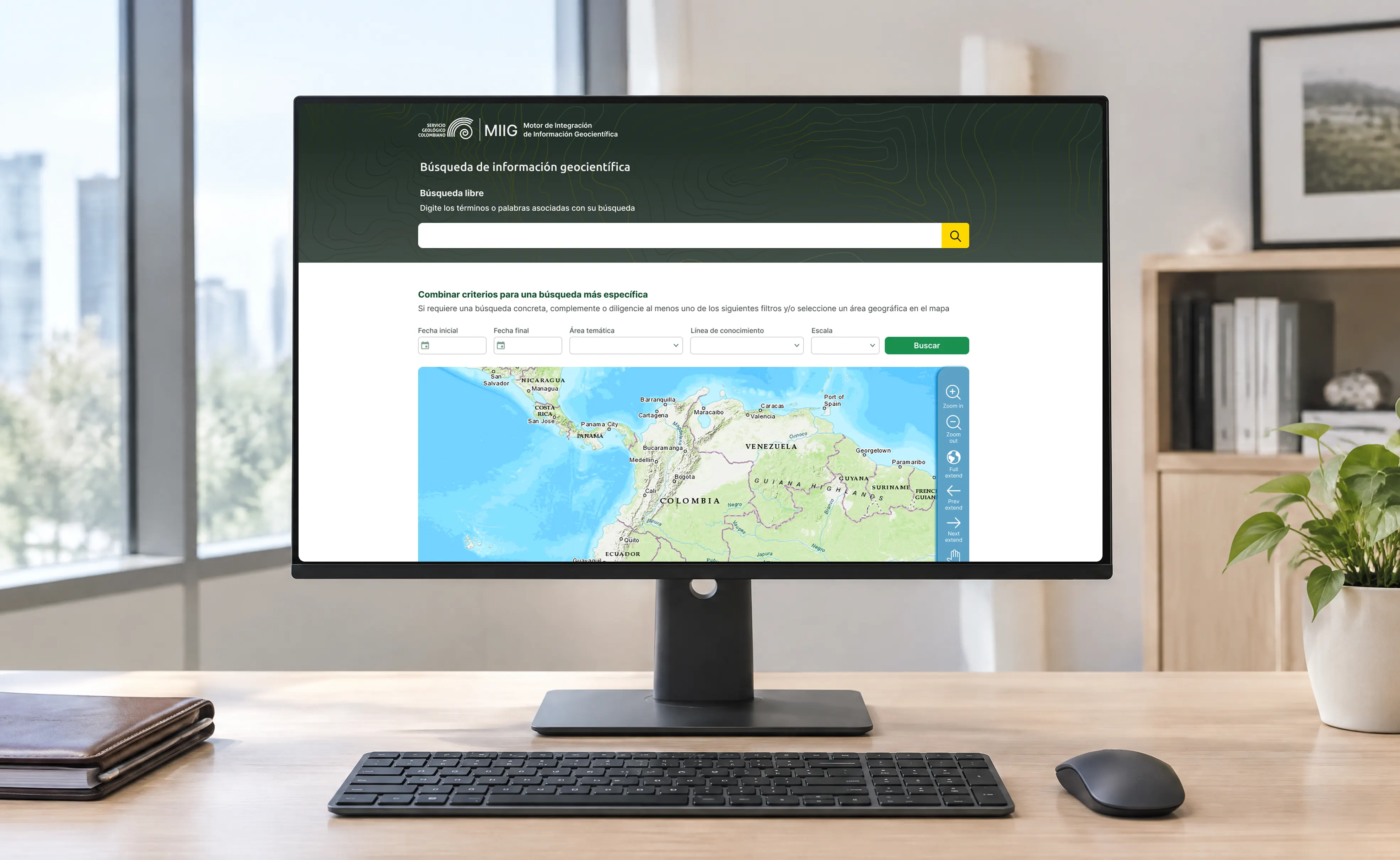 Servicio Geológico Colombiano geoscientific information search page shown on a desktop monitor, with the free text search bar, combined filters and the map of Colombia.